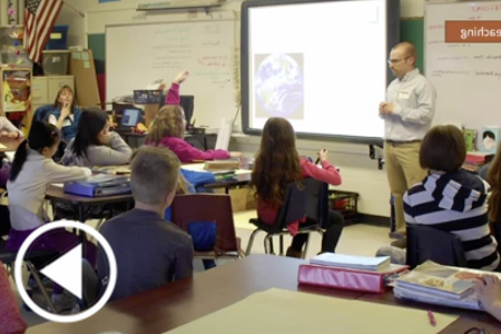 Elementary Age Students Being Taught by a Guest Speaker